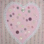A pink appliqué heart on a pink patchwork shopping bag project with pretty buttons.