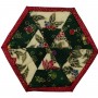 One of six Christmas coasters. This one has a pleasing triangular pattern in the centre surrounded by cream and green panels and a red border.