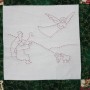 One of four quilted panels on the Christmas wall-hanging. An Angel appears before the Shepherds.