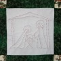 One of four quilted panels on the Christmas wall-hanging. Lying in a manger.