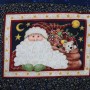 A view of the printed Father Christams image at the center of the log cabin table-mat