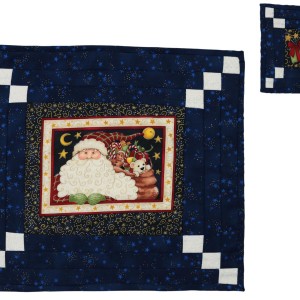 A table-mat and coaster made in a dark blue colour with white details. A traditional Christmas Santa picture appears in the center of the table-mat and a Christmas parcel with a red bow in the center of the coaster.