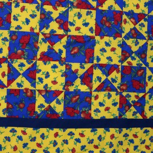 A detail of the Ohio Star Tablecloth showing approximately nine panels and a section of the border.